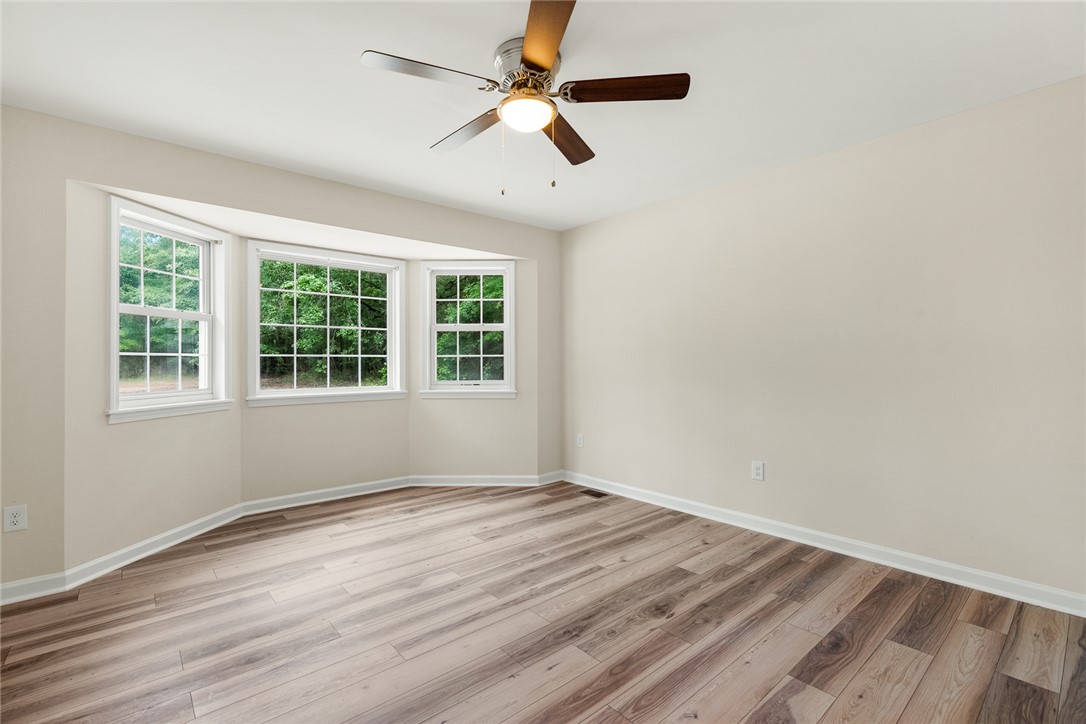 131 Lockaby Road Pelzer, SC 29669 - Photo 23 of 50 Bright and airy, this room features expansive bay windows, perfect for natural light and serene views.