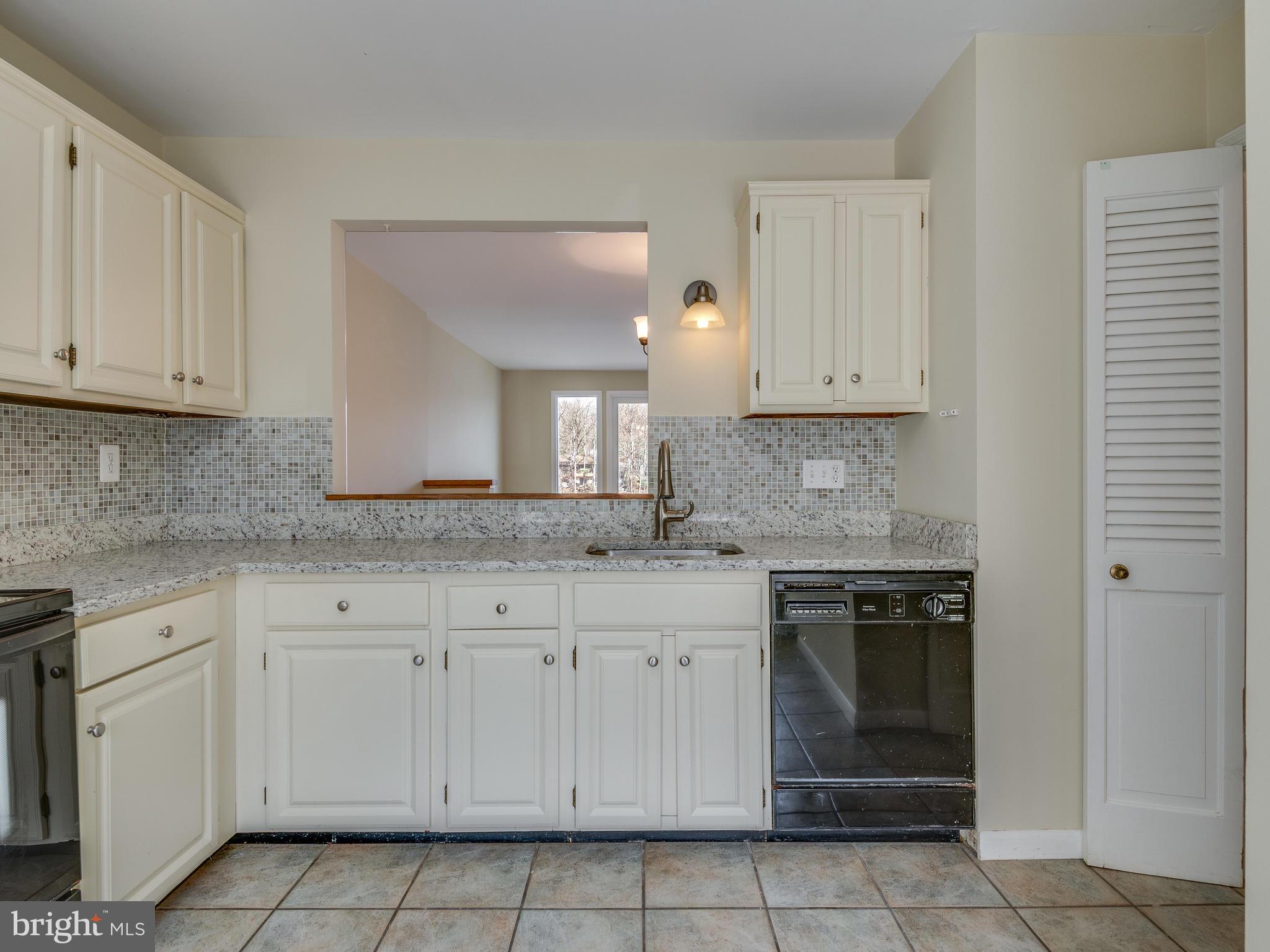 2017 Chadds Ford Drive Reston, VA 20191 - Photo 6 of 32 A view to the lake from the kitchen