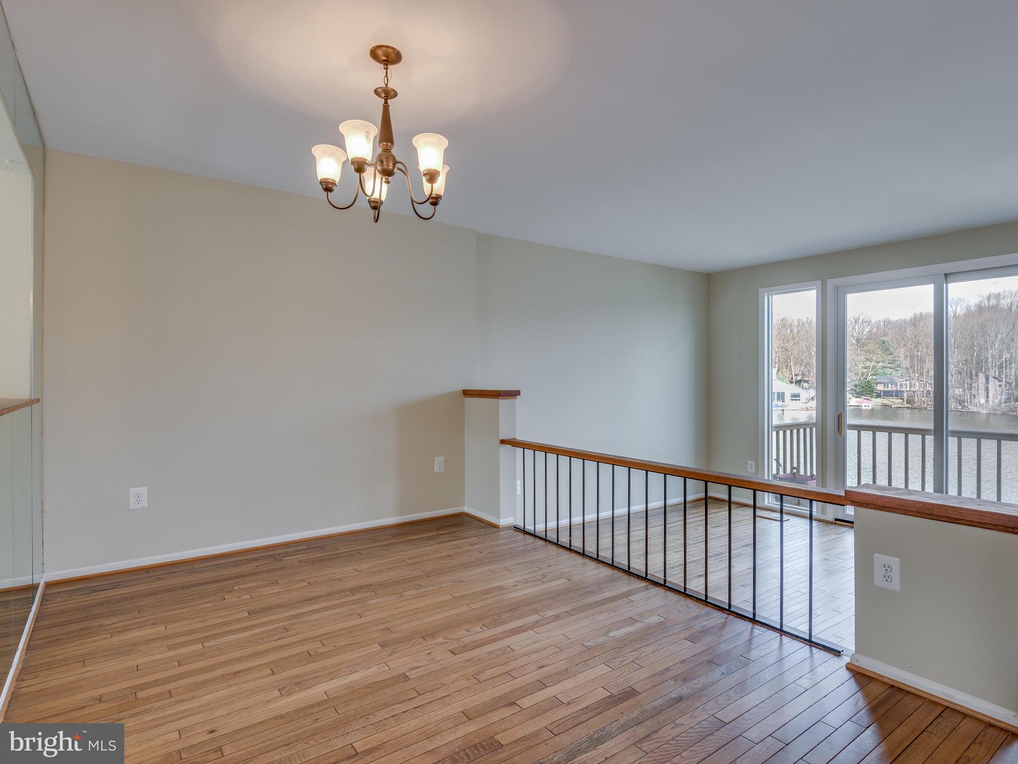 2017 Chadds Ford Drive Reston, VA 20191 - Photo 8 of 32 Dining overlooks the living room with view to lake