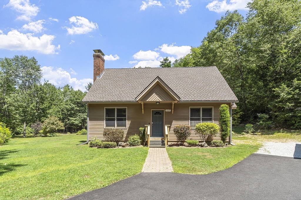 117 Dudley Road Templeton, MA 01468 - Photo 3 of 39 a front view of house with yard and trees in the background