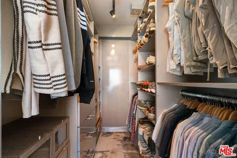 a bedroom with a bed and a furniture