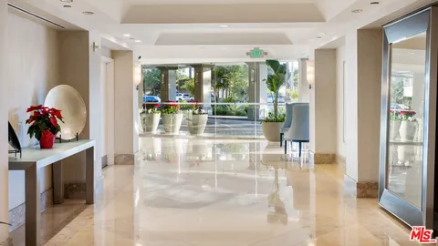 a view of a hallway with seating area