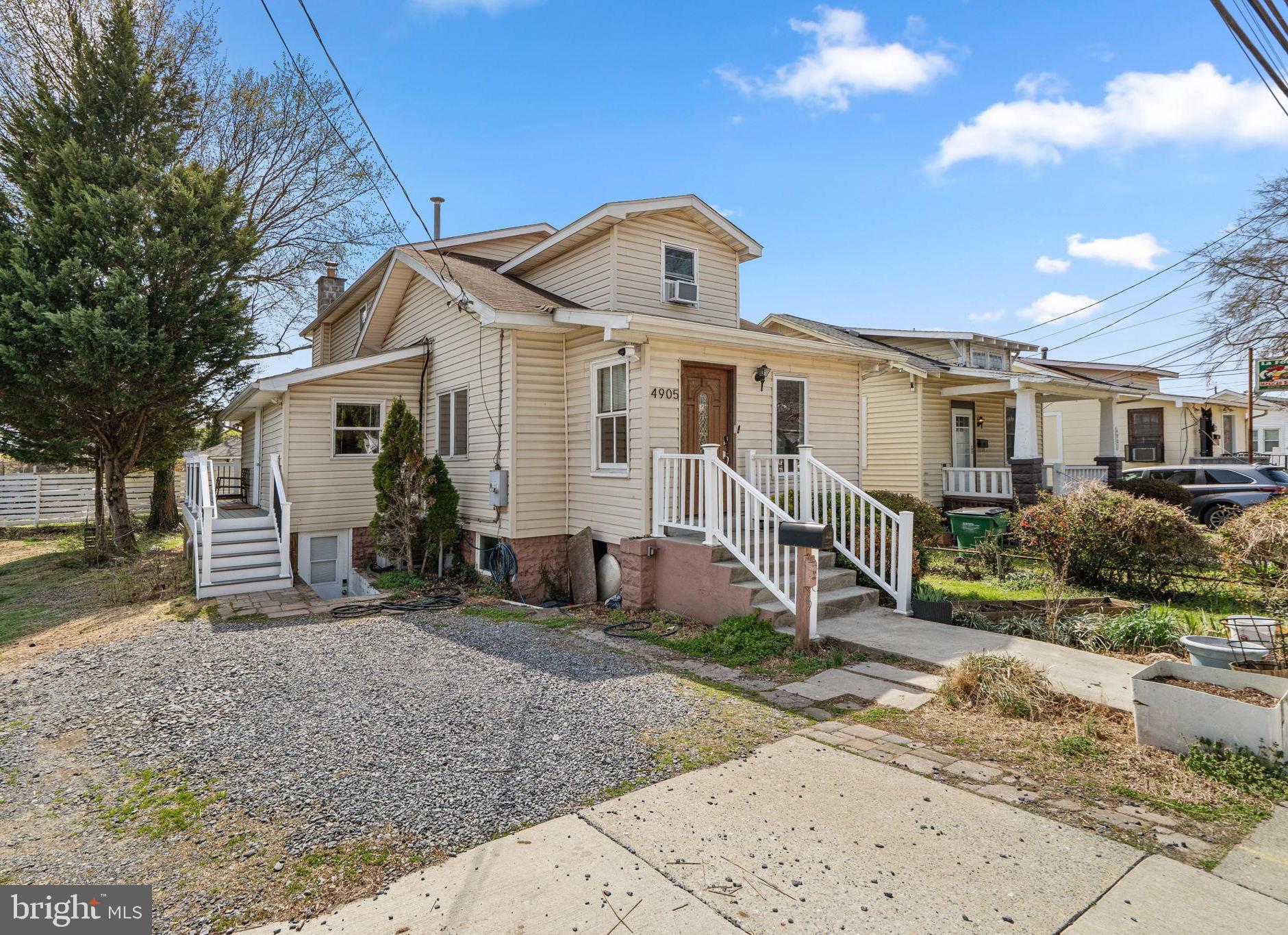 4905 Decatur Street Hyattsville, MD 20781 - Photo 1 of 25 a front view of a house with garden