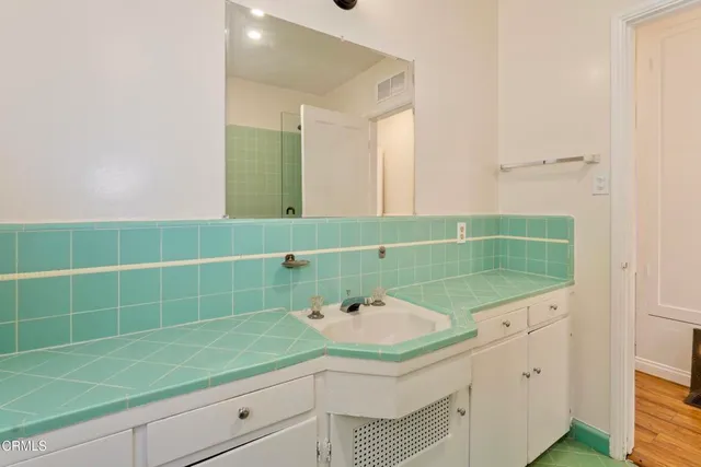 a bathroom with a sink and a mirror