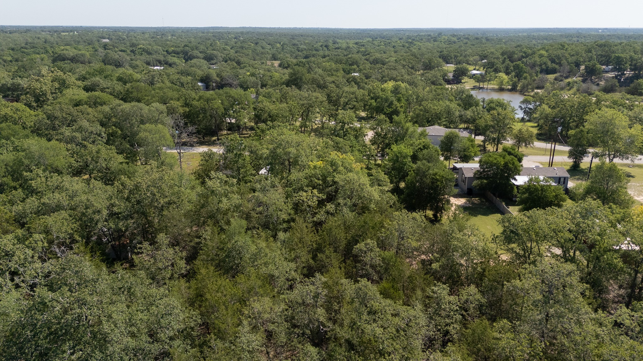 TBD Hill Loop Road Somerville, TX 77879 - Photo 7 of 13 an aerial view of residential house with outdoor space and trees all around