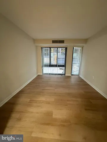 a view of a room with lots of white furniture