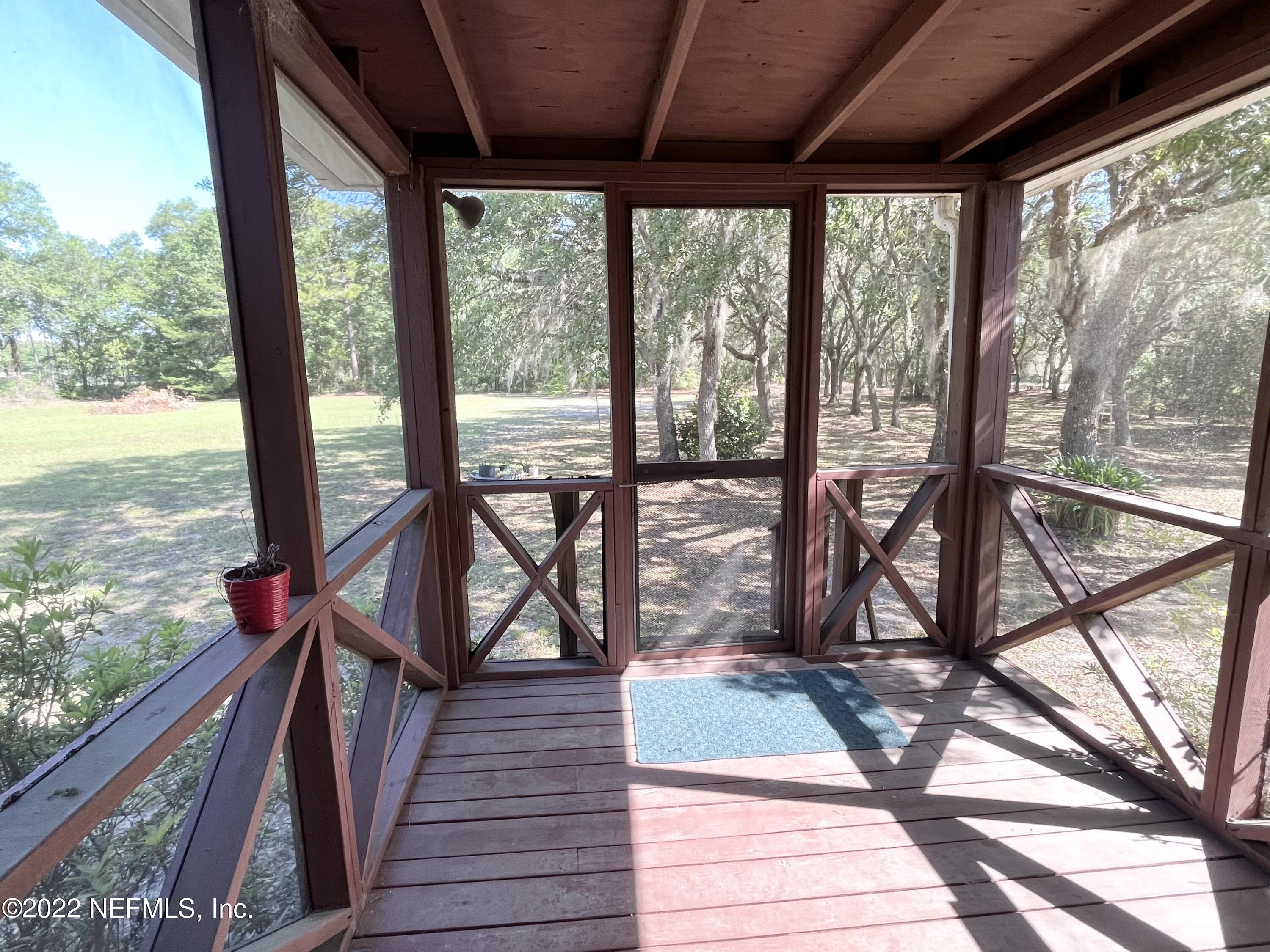 400 East Bannerville Road Palatka, FL 32177 - Photo 15 of 23 Screened back porch