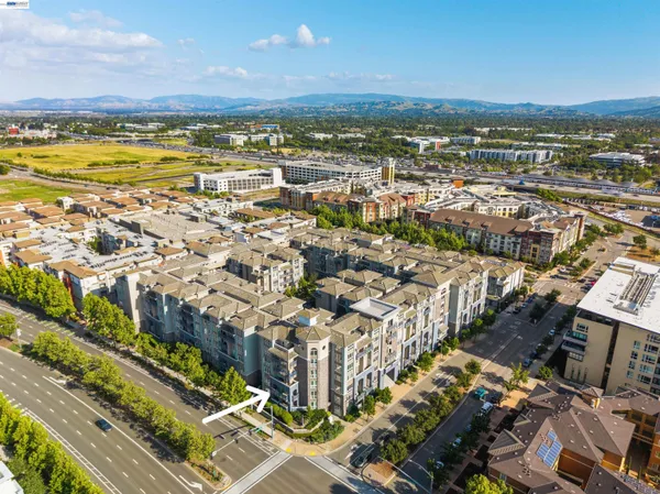 an aerial view of residential building and ocean