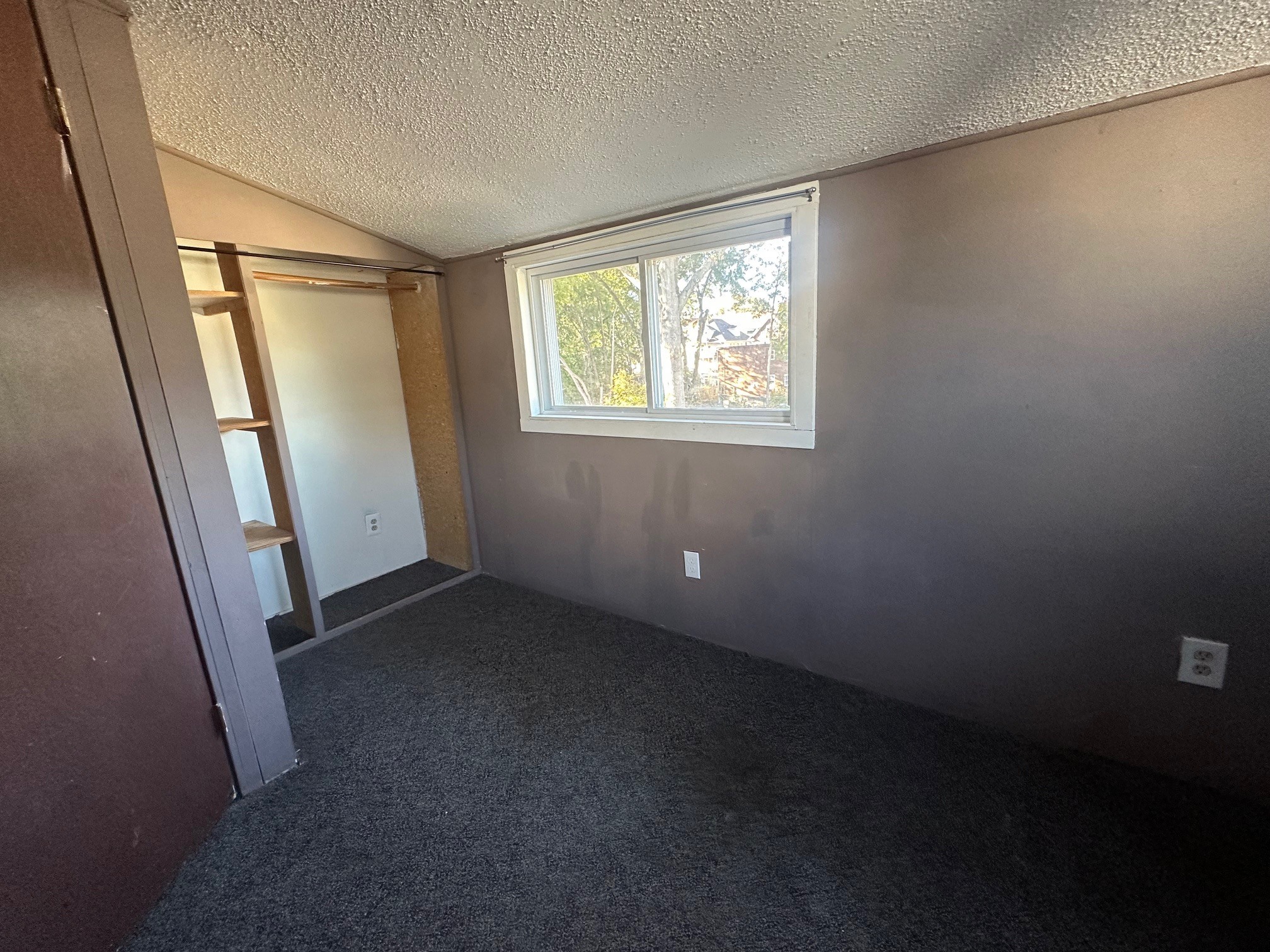 176 Adelaide Street, Unit 3 Hartford, CT 06114 - Photo 3 of 8 an empty room with windows