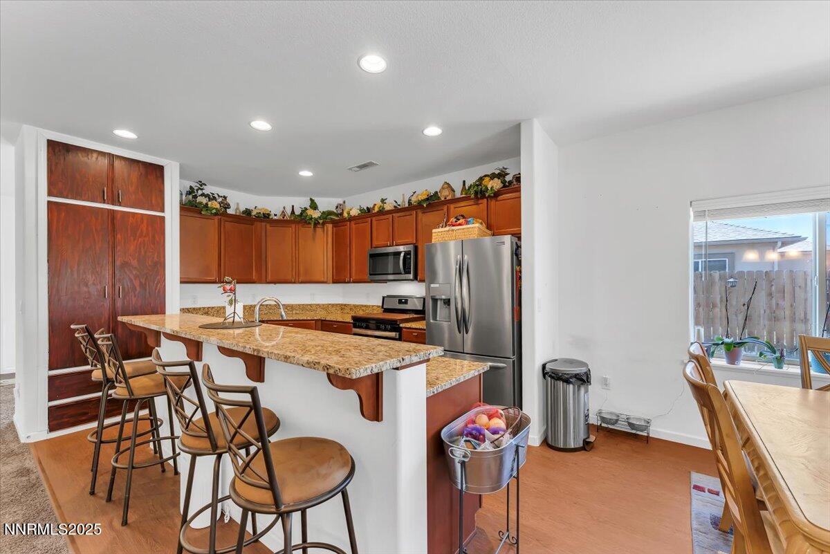 1178 Jasmine Lane Fernley, NV 89408 - Photo 12 of 65 a view of a dining room with furniture