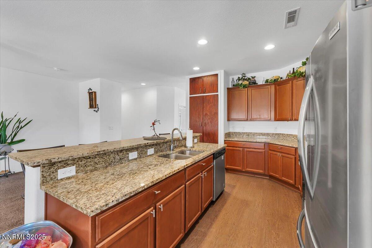 1178 Jasmine Lane Fernley, NV 89408 - Photo 13 of 65 a bathroom with a granite countertop sink and a mirror