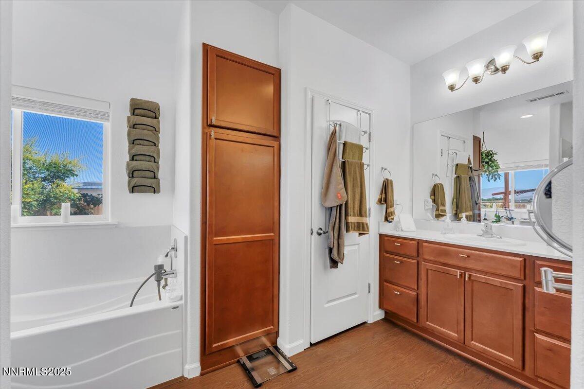1178 Jasmine Lane Fernley, NV 89408 - Photo 18 of 65 a bathroom with a tub sink and a mirror