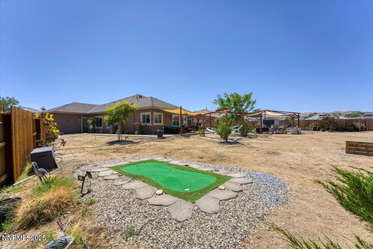 1178 Jasmine Lane Fernley, NV 89408 - Photo 34 of 65 a view of a house with a yard
