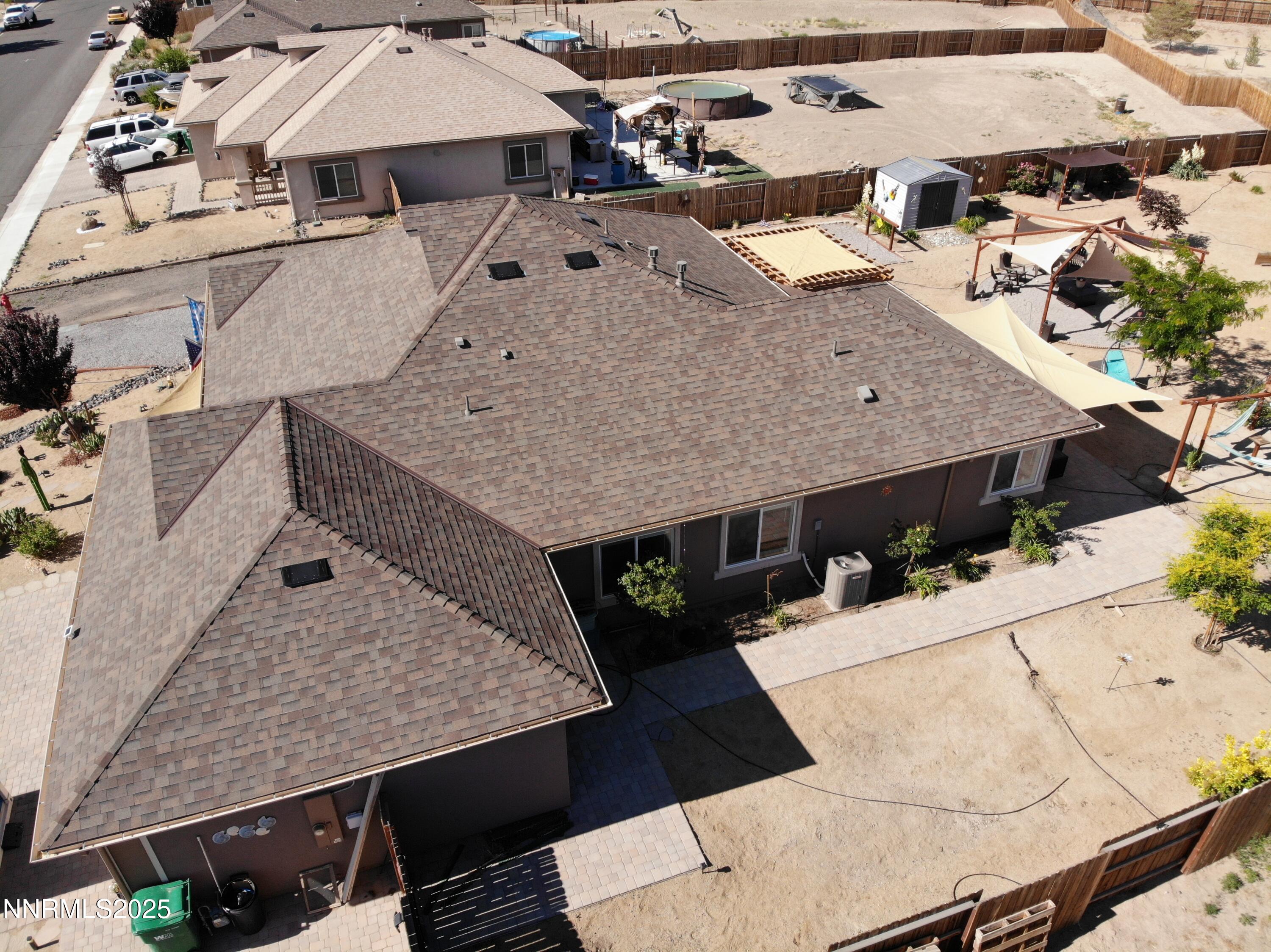 1178 Jasmine Lane Fernley, NV 89408 - Photo 45 of 65 an aerial view of a house with large trees