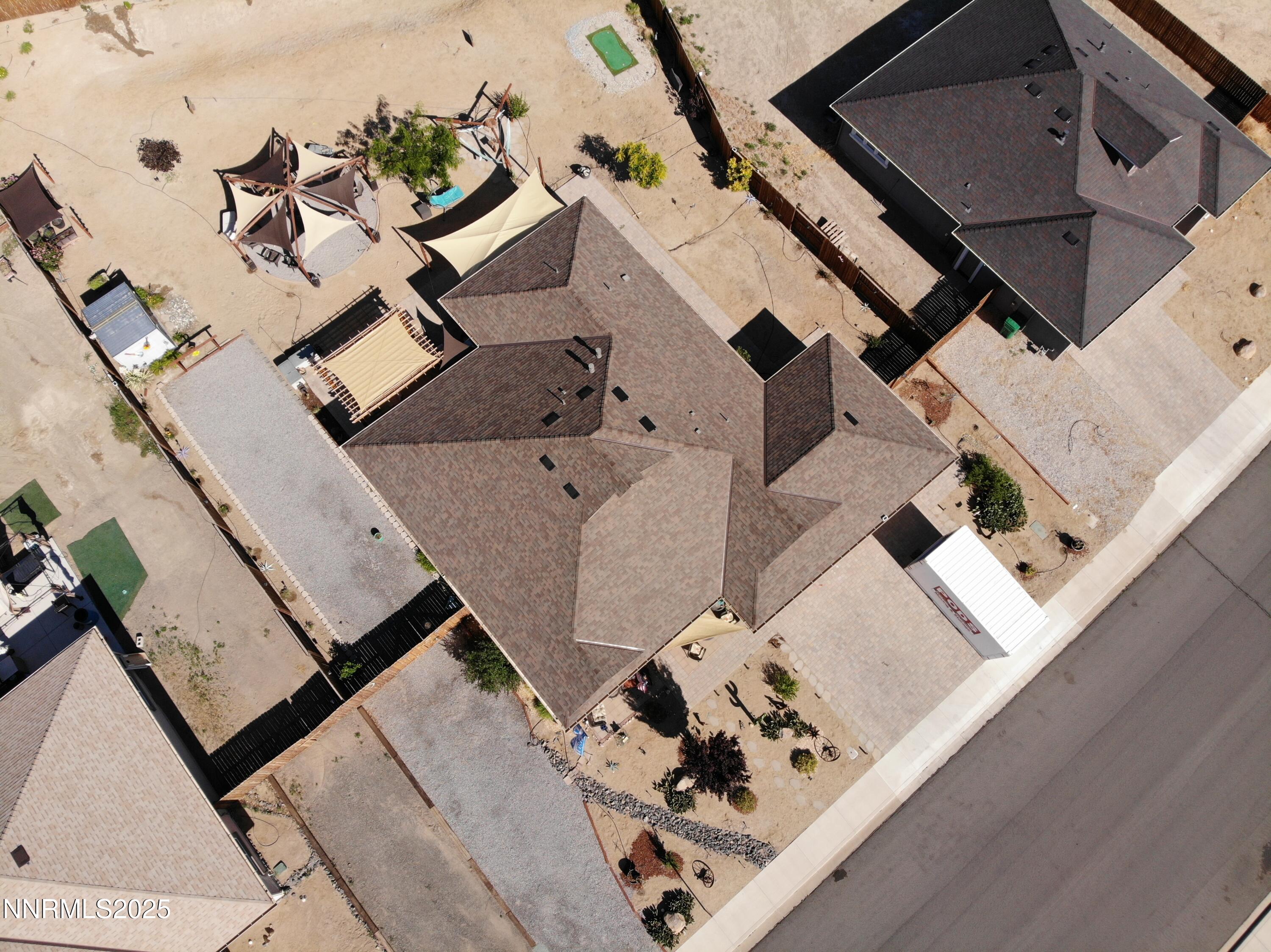 1178 Jasmine Lane Fernley, NV 89408 - Photo 49 of 65 an aerial view of a house with a big yard and patio