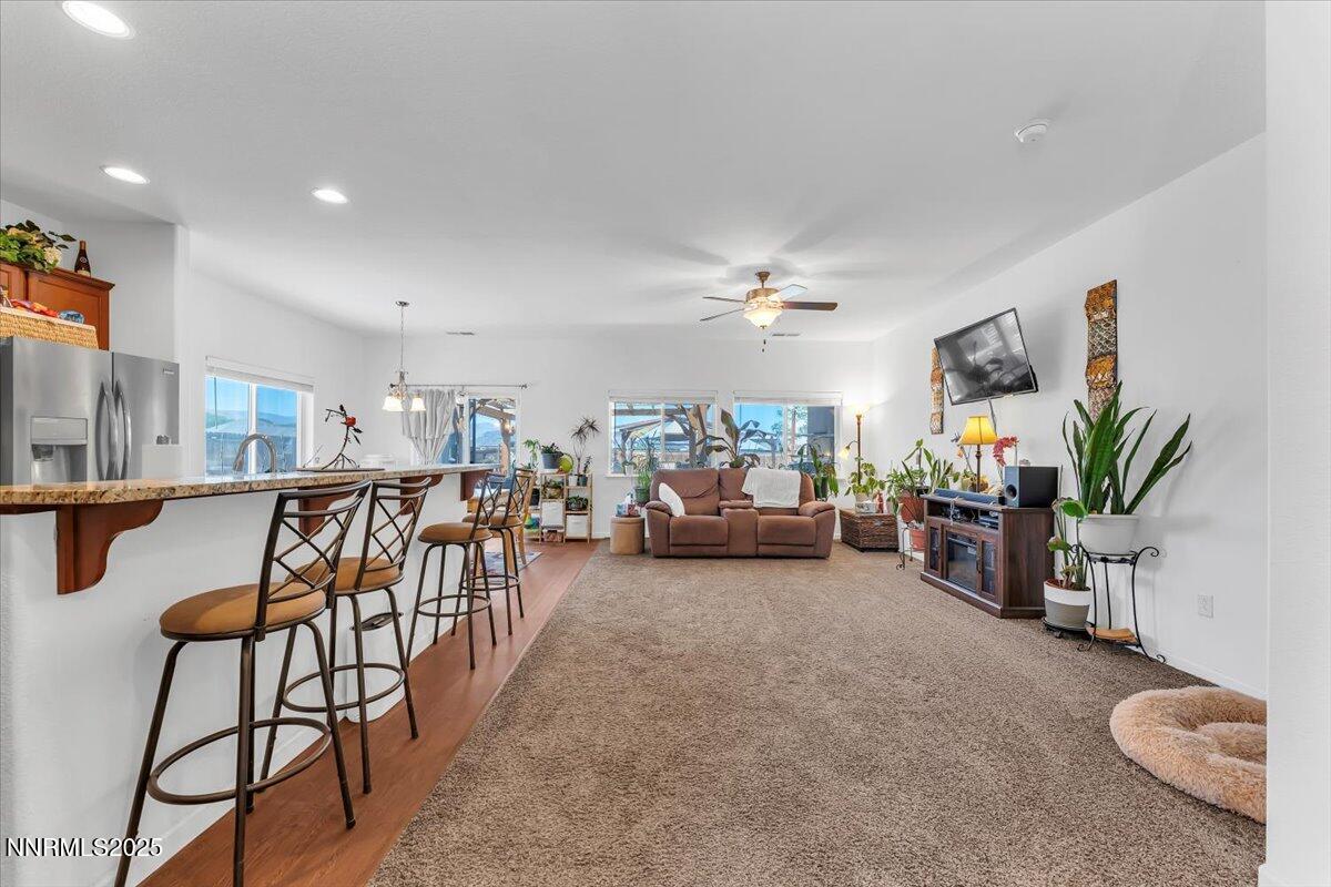 1178 Jasmine Lane Fernley, NV 89408 - Photo 5 of 65 a living room with furniture and a potted plant