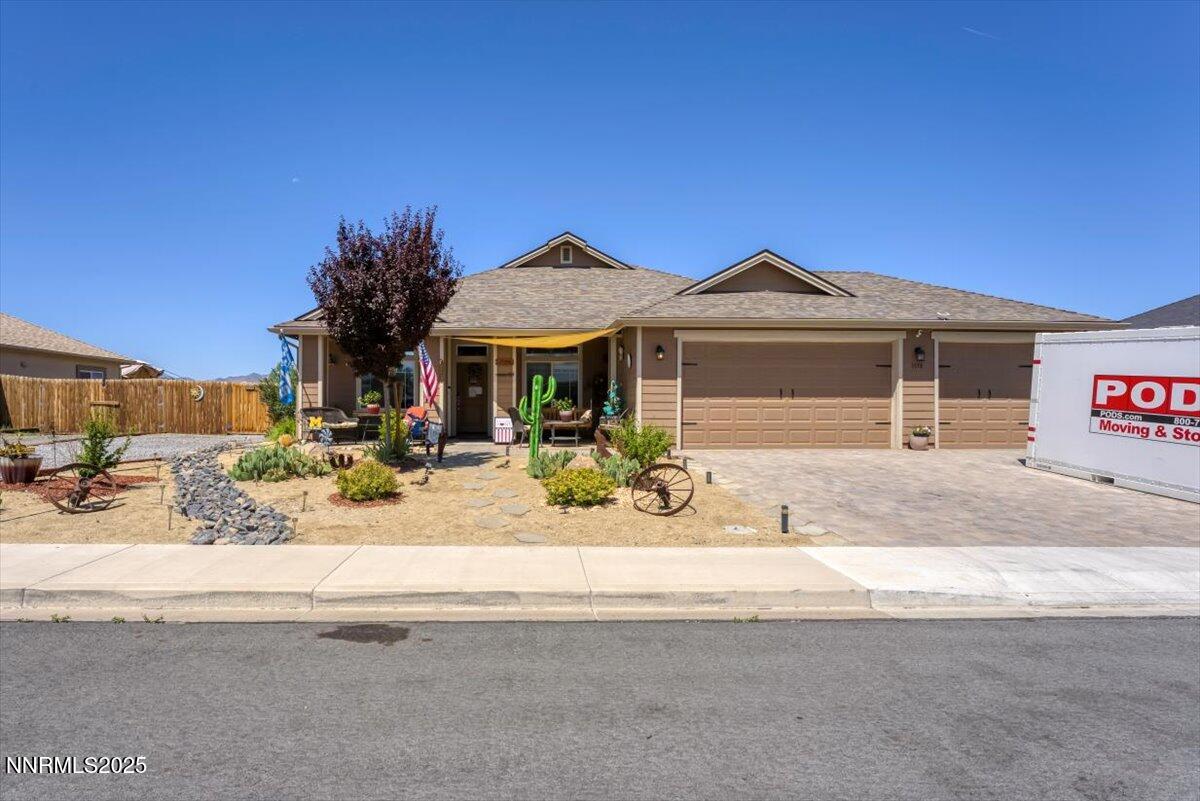 1178 Jasmine Lane Fernley, NV 89408 - Photo 60 of 65 a front view of a house with a yard