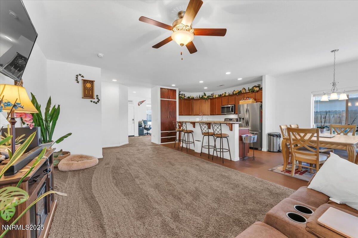 1178 Jasmine Lane Fernley, NV 89408 - Photo 8 of 65 a room with furniture and a flat screen tv