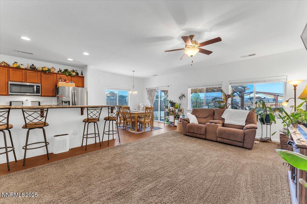 1178 Jasmine Lane Fernley, NV 89408 - Photo 9 of 65 a living room with furniture and kitchen view