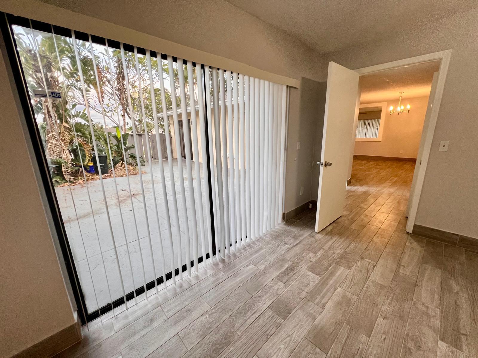 8113 Ambach Way, Unit 28A Hypoluxo, FL 33462 - Photo 13 of 20 a view of a porch with wooden floor and stairs