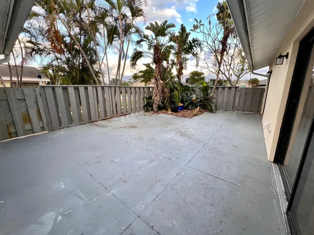 a view of a backyard of the house