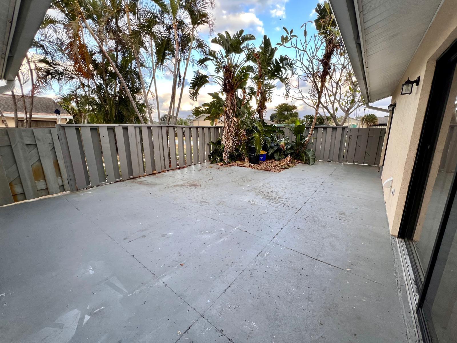 8113 Ambach Way, Unit 28A Hypoluxo, FL 33462 - Photo 19 of 20 a view of a backyard of the house