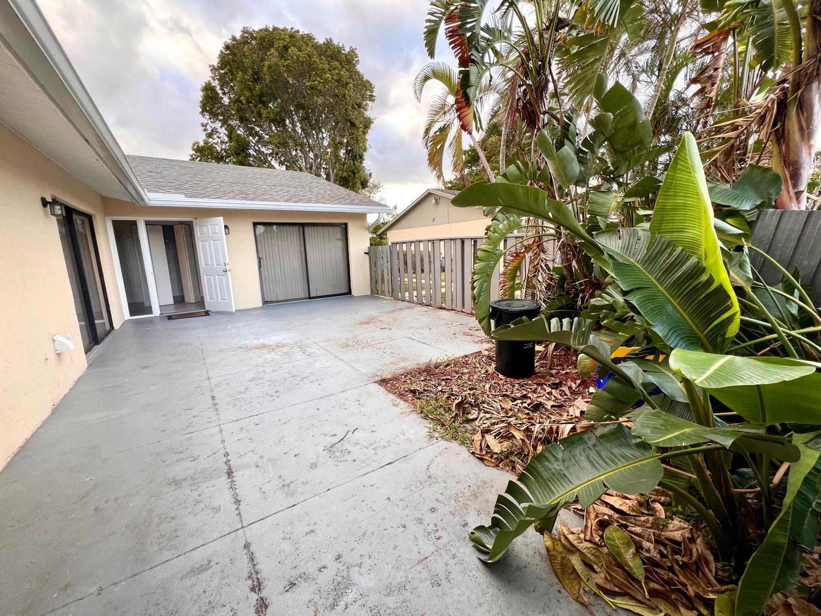 8113 Ambach Way, Unit 28A Hypoluxo, FL 33462 - Photo 20 of 20 a view of a house with a patio