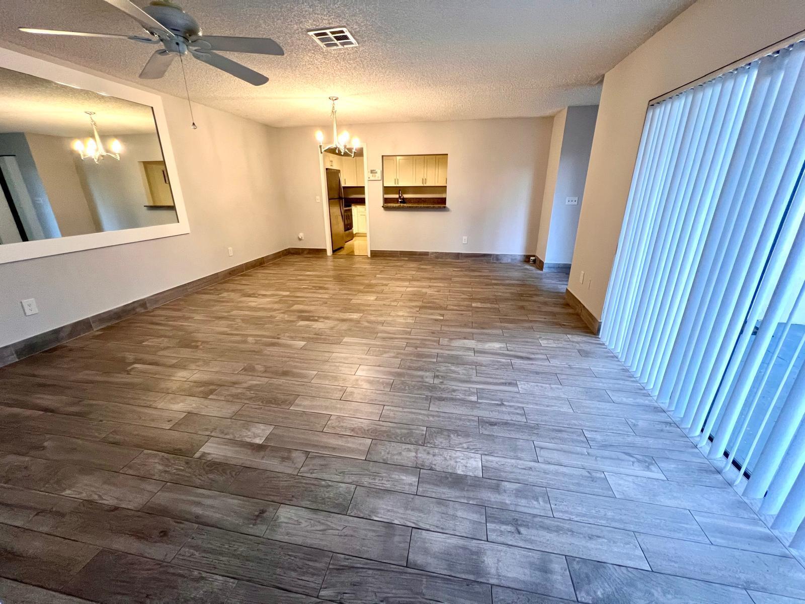 8113 Ambach Way, Unit 28A Hypoluxo, FL 33462 - Photo 9 of 20 a view of a livingroom with wooden floor