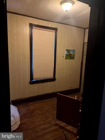 a room with closet and wooden closet