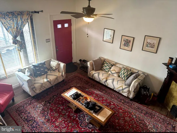 a kitchen with stainless steel appliances granite countertop a refrigerator a stove and a wooden floors