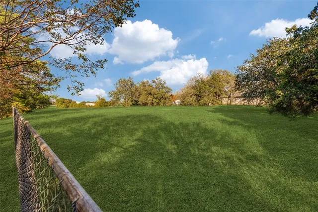 a view of a golf course with a lake