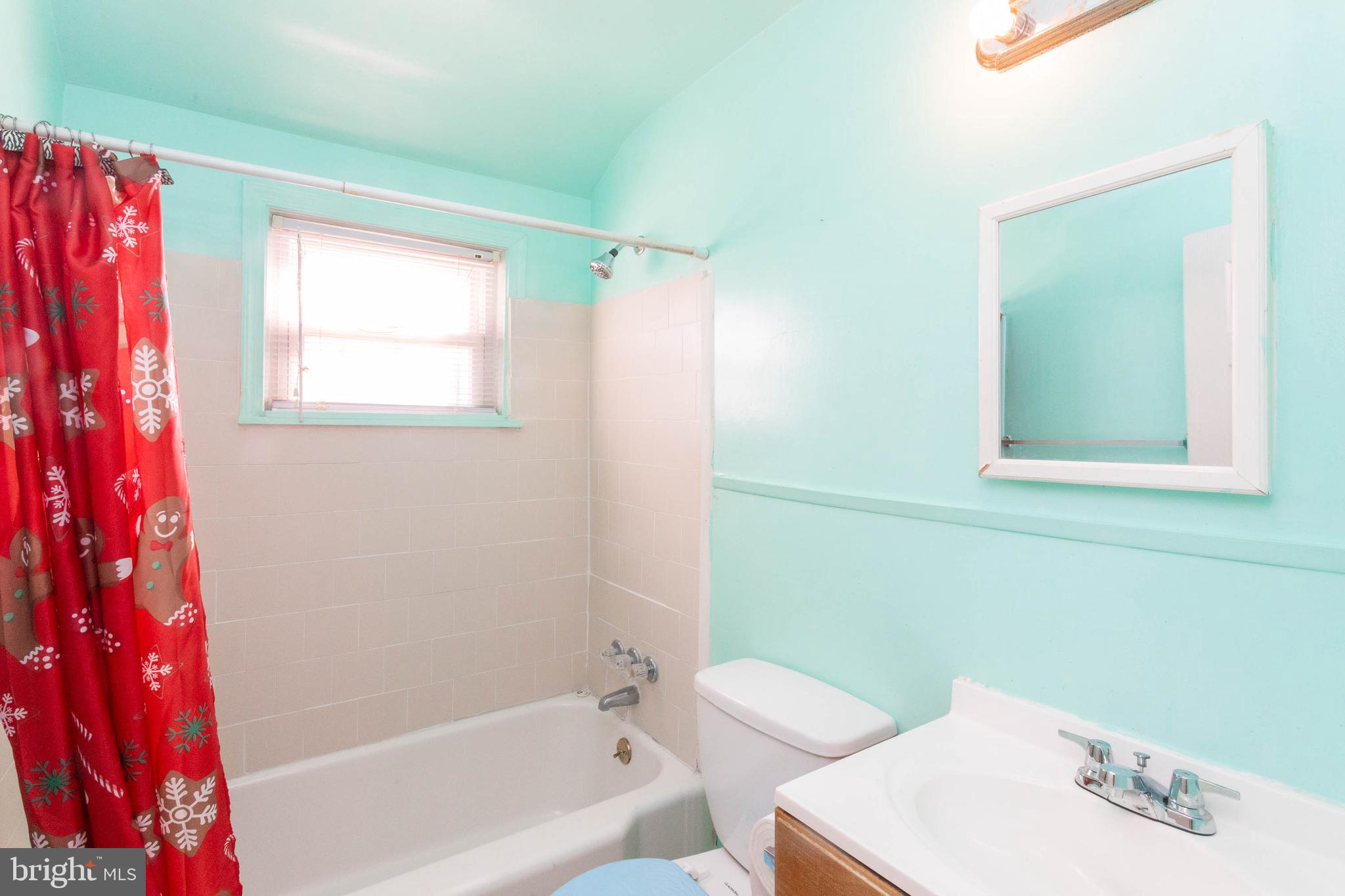 1919 Larkhall Road Dundalk, MD 21222 - Photo 13 of 23 a bathroom with a sink and a bathtub