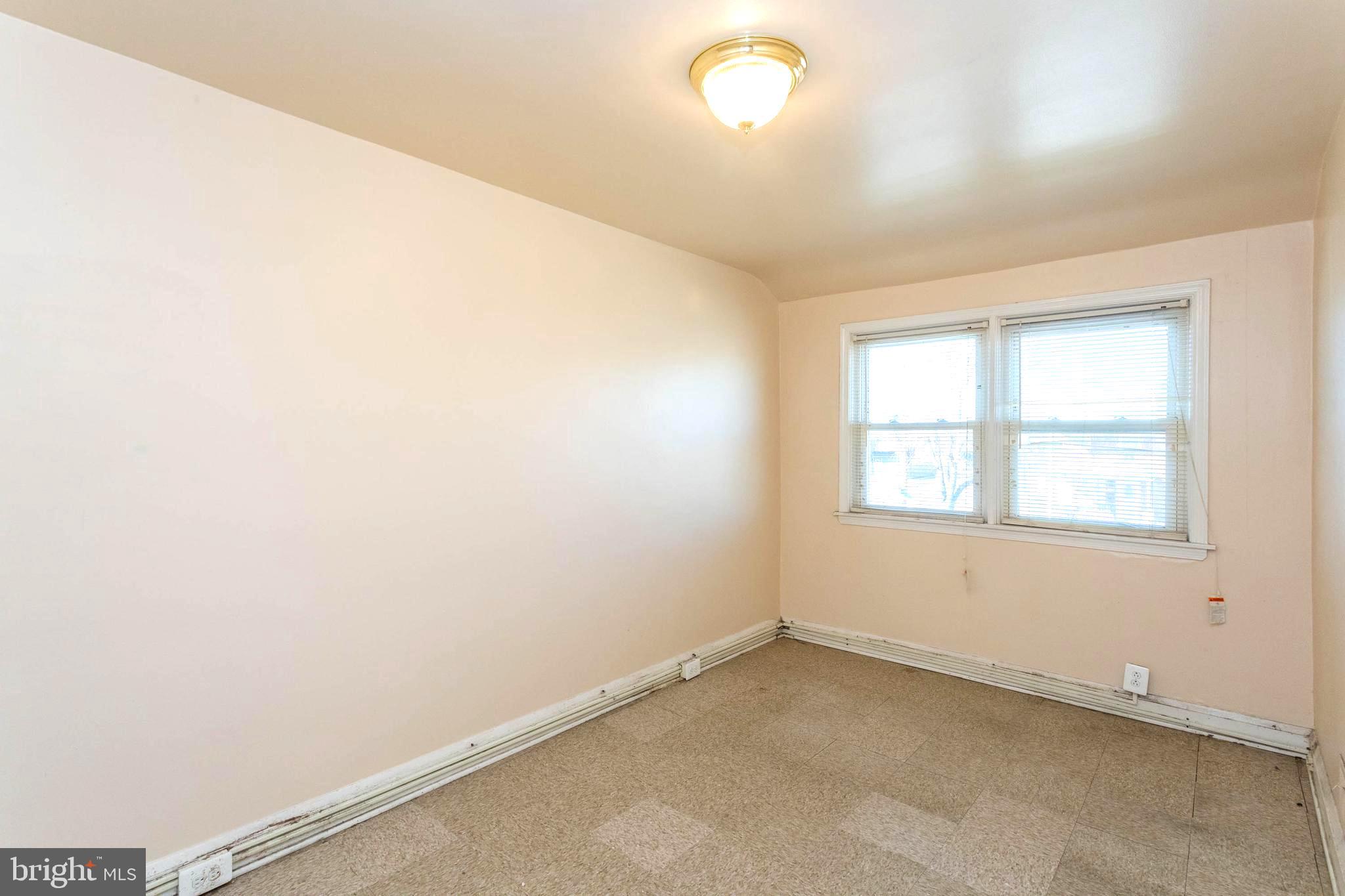 1919 Larkhall Road Dundalk, MD 21222 - Photo 16 of 23 an empty room with a window