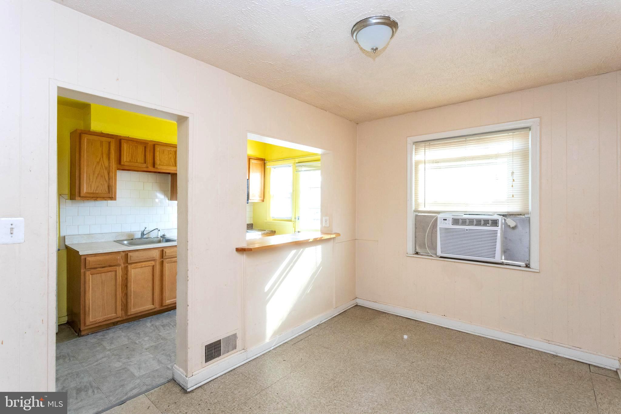 1919 Larkhall Road Dundalk, MD 21222 - Photo 8 of 23 a view of an empty room with a window