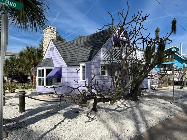 a view of backyard with wheel chair and potted plants