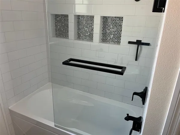 an empty room with a bathroom