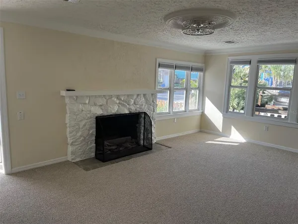 an empty room with a fireplace