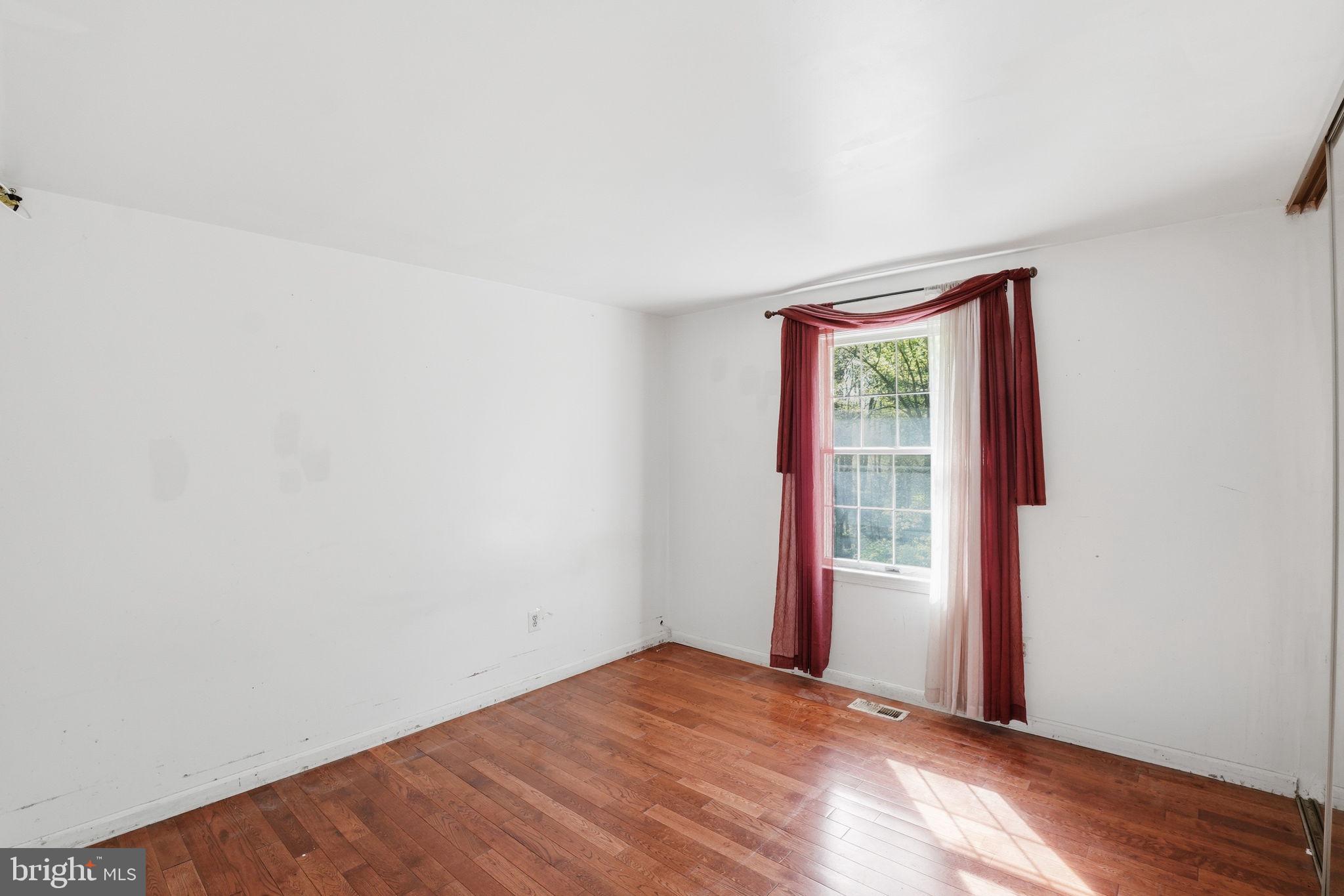 17107 Overhill Road Rockville, MD 20855 - Photo 15 of 37 a view of empty room with wooden floor and fan
