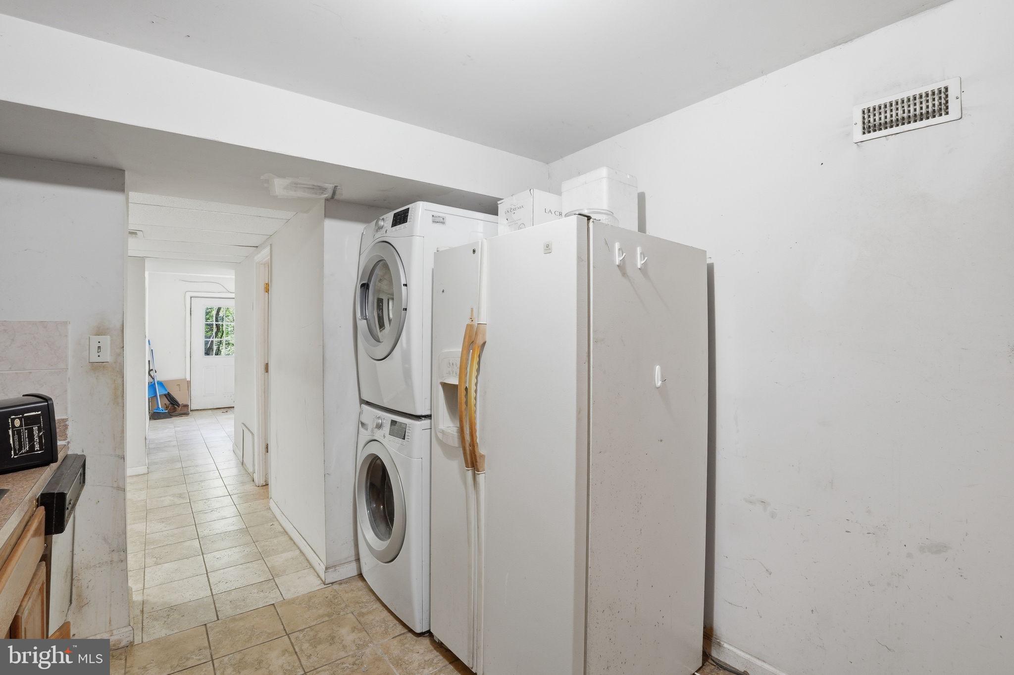 17107 Overhill Road Rockville, MD 20855 - Photo 27 of 37 a utility room with dryer and washer