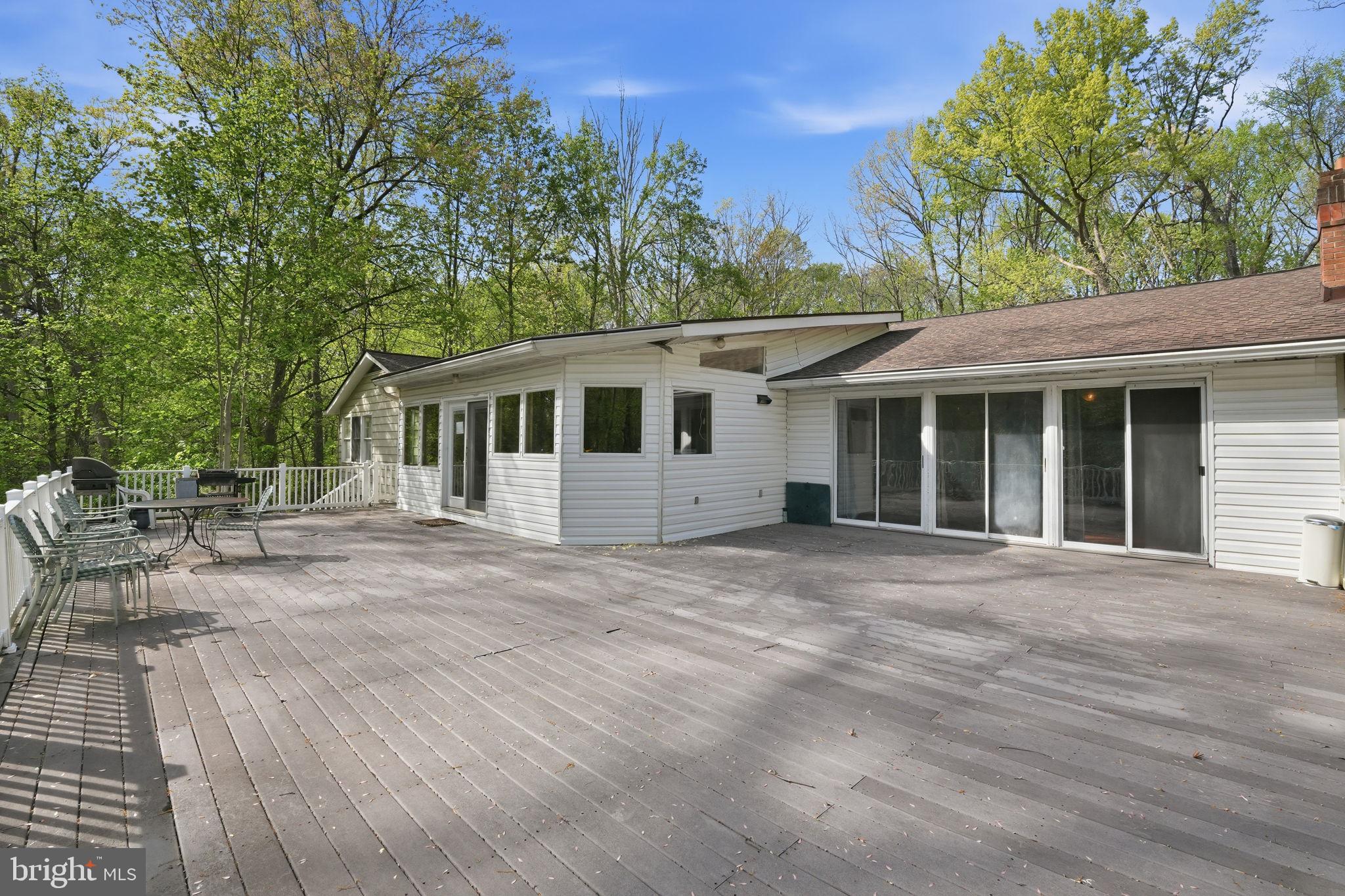 17107 Overhill Road Rockville, MD 20855 - Photo 31 of 37 a view of a house with backyard and sitting area