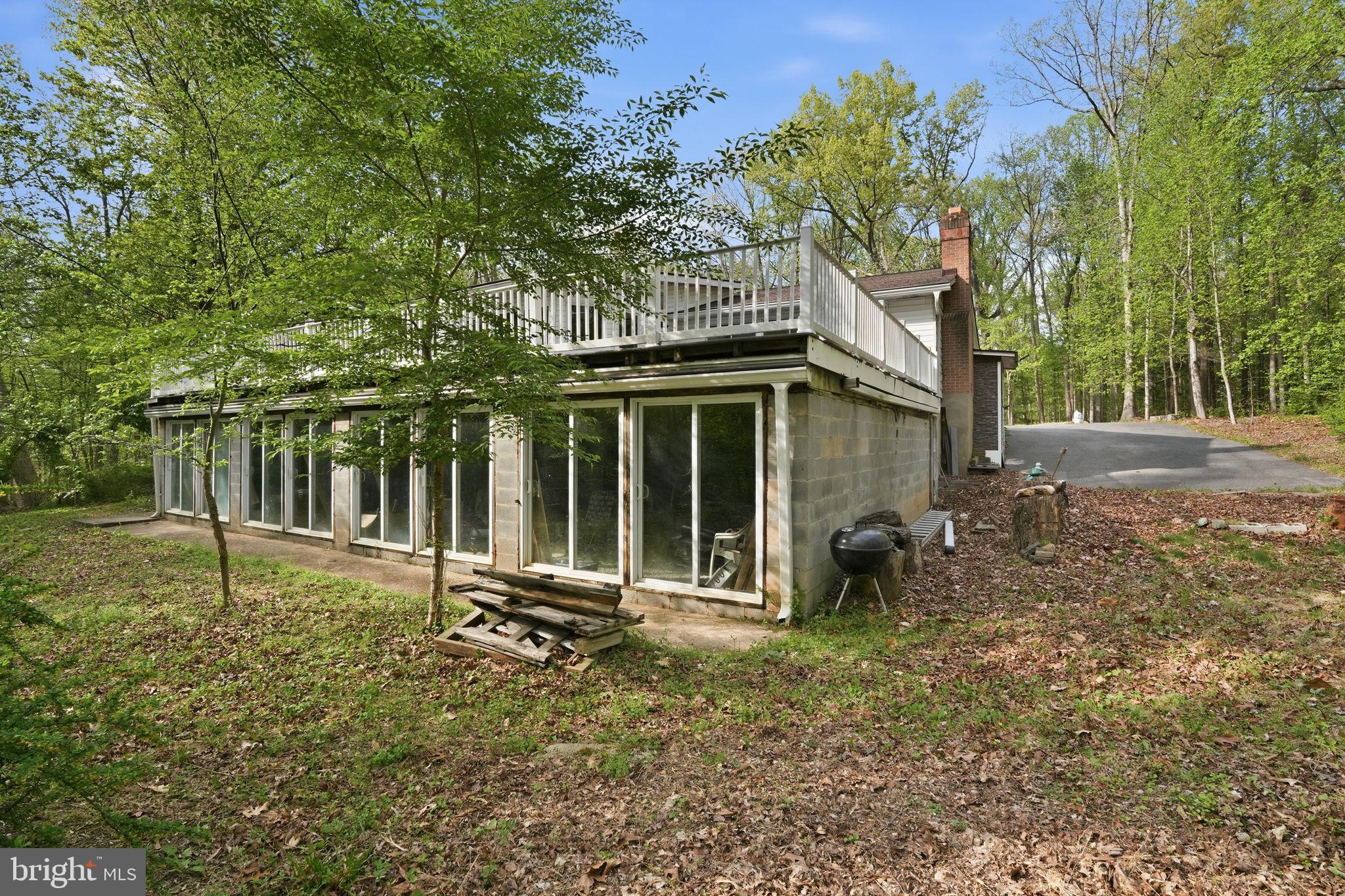 17107 Overhill Road Rockville, MD 20855 - Photo 32 of 37 a backyard of a house with seating space