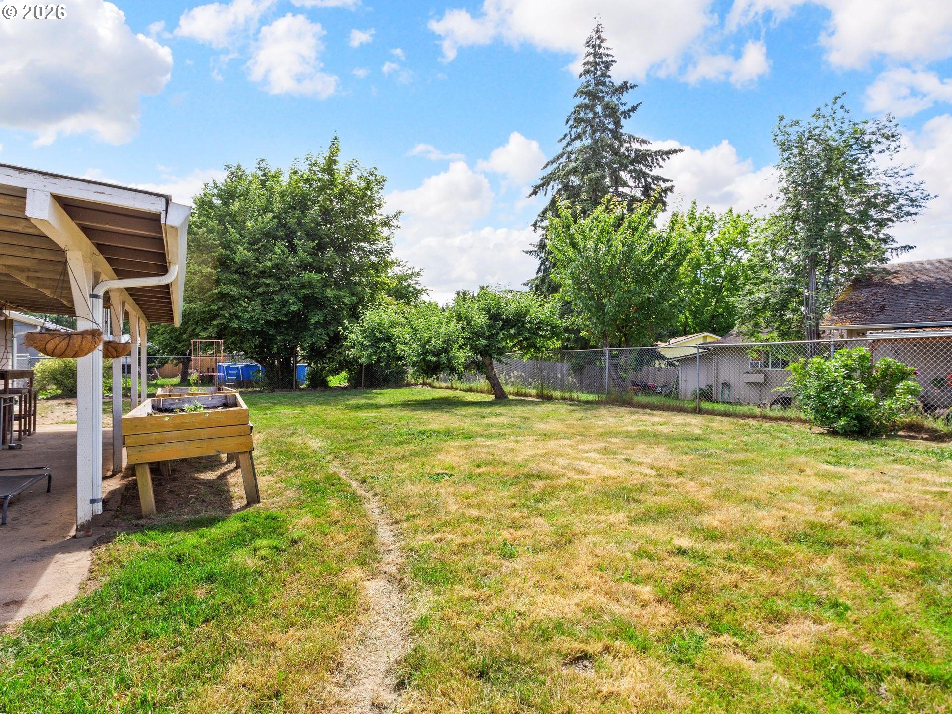 1719 Southwest 1st Street Battle Ground, WA 98604 - Photo 35 of 37 a backyard of a house with table and chairs
