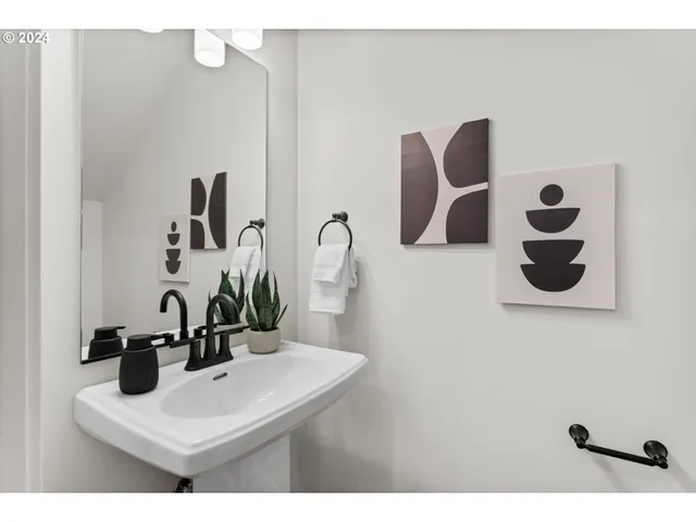 a bathroom with a sink and mirror