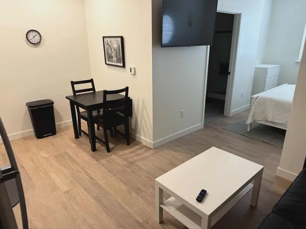 a living room with furniture and a table