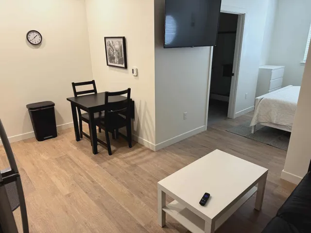 a living room with furniture and a table