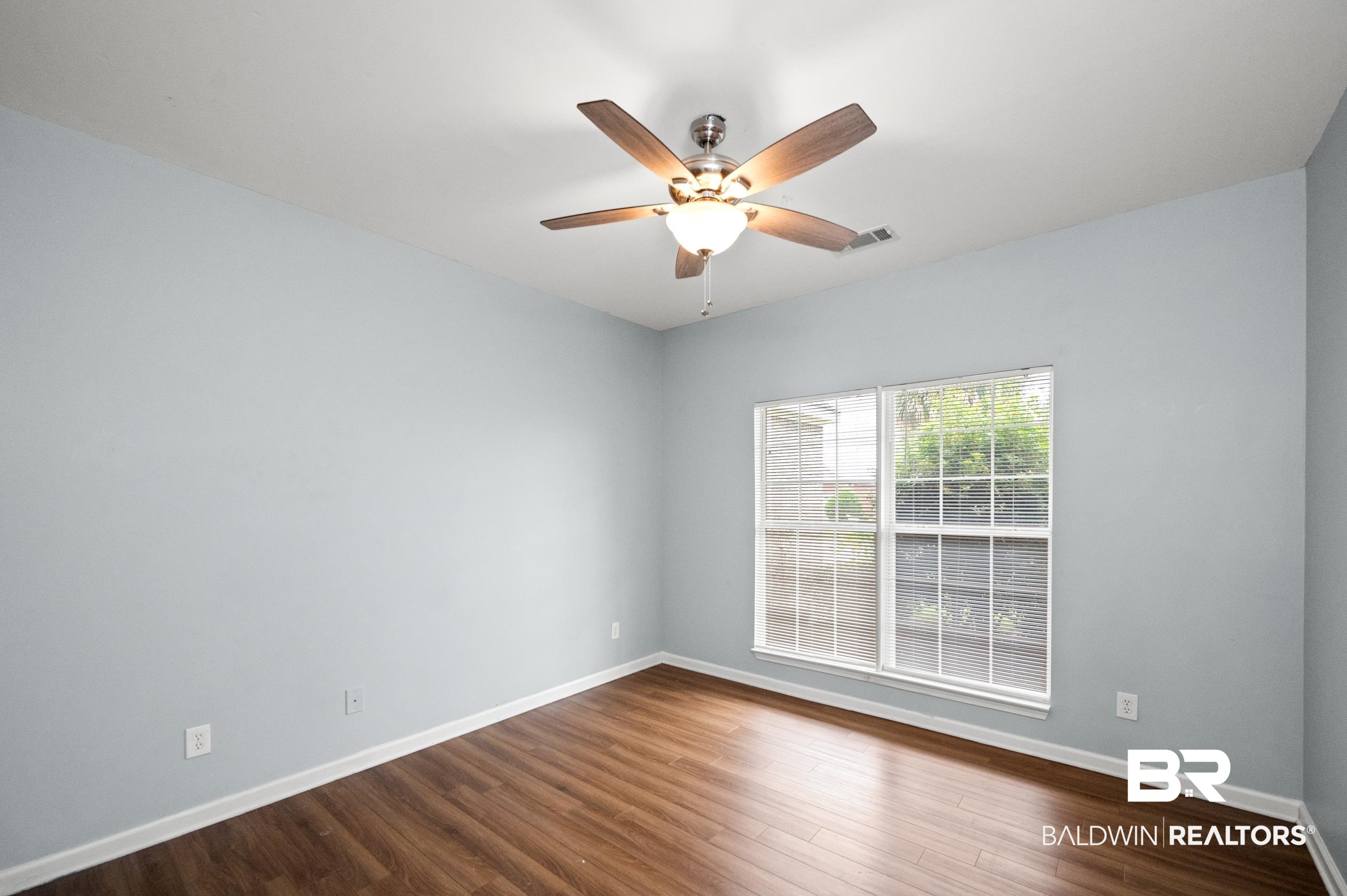 1333 Dominoe Trail Foley, AL 36535 - Photo 16 of 32 Spare room featuring ceiling fan and dark hardwood / wood-style floors