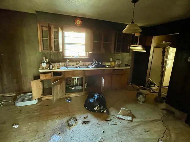 a room with gym equipment and windows