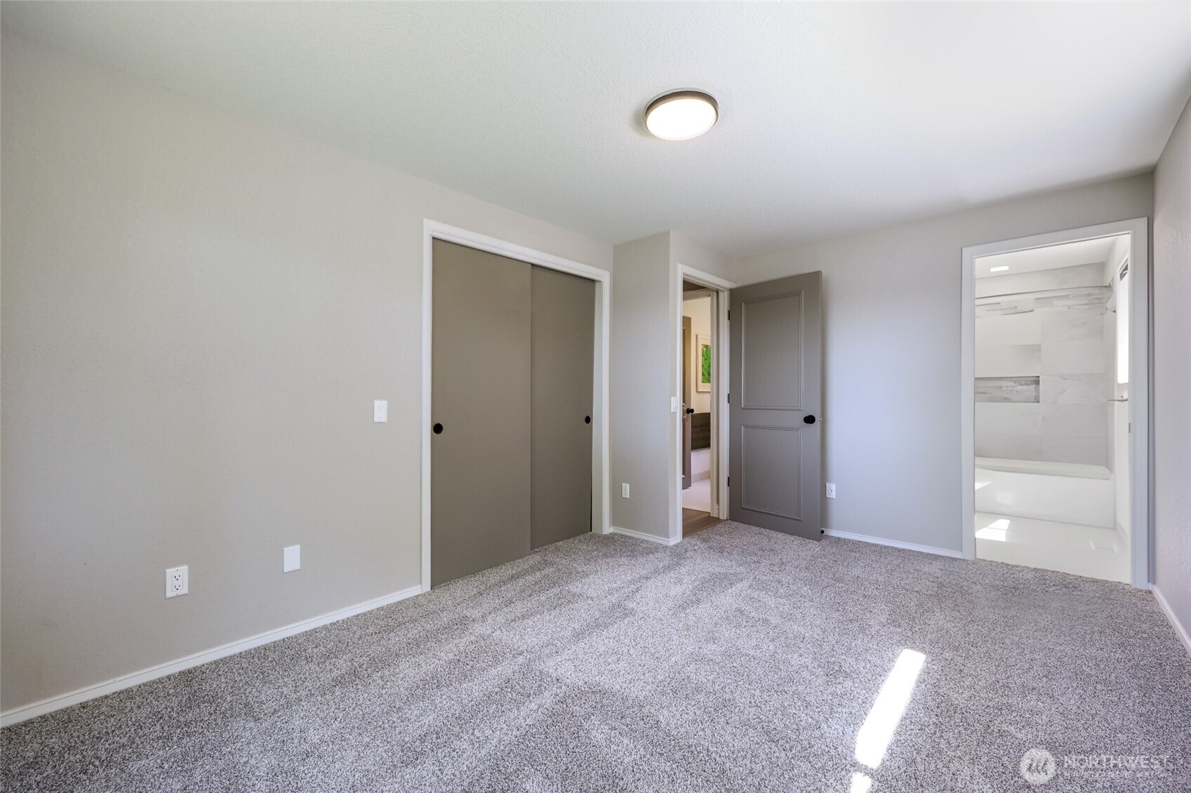7713 78th Loop Northwest Olympia, WA 98502 - Photo 23 of 40 an empty room with closet and a bathroom