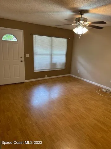 a view of room with window and hardwood floor