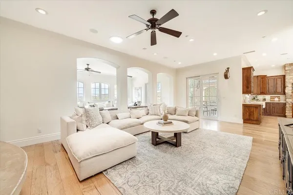 a view of a livingroom with a fireplace and a window